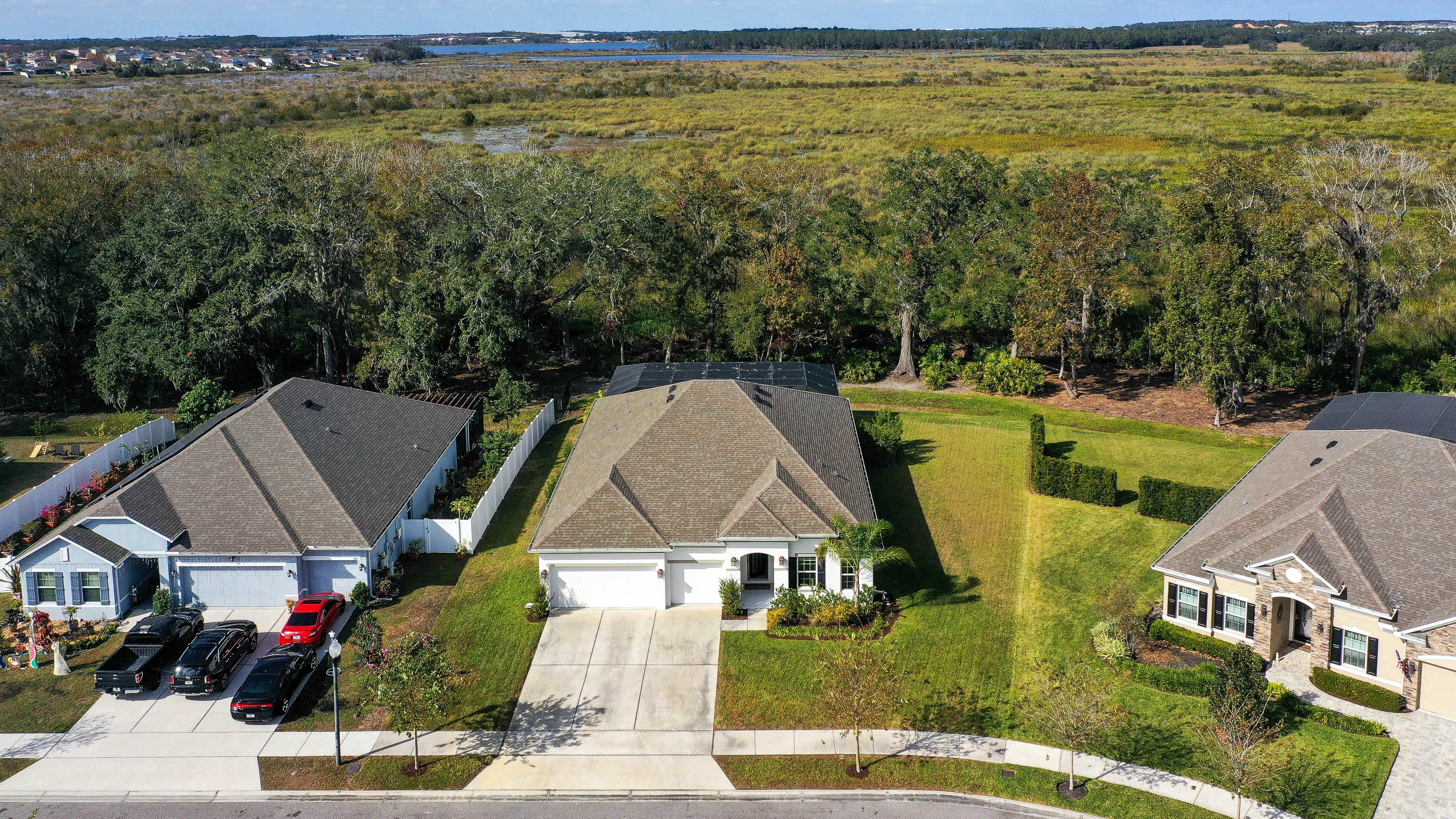 drone shot of homes off of a conservation in clermont