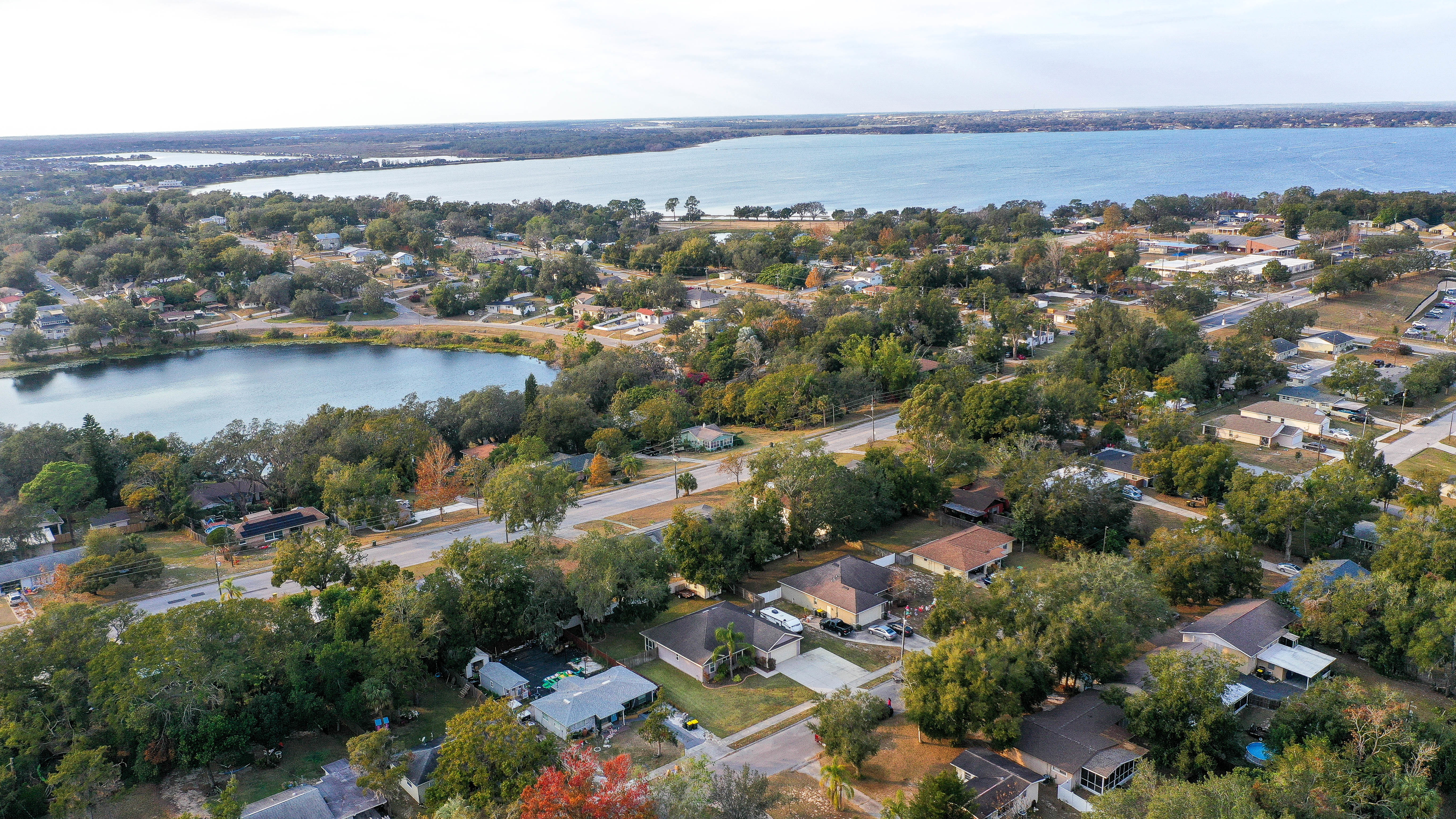 drone shot of clermont neighborhood with homes and lakes